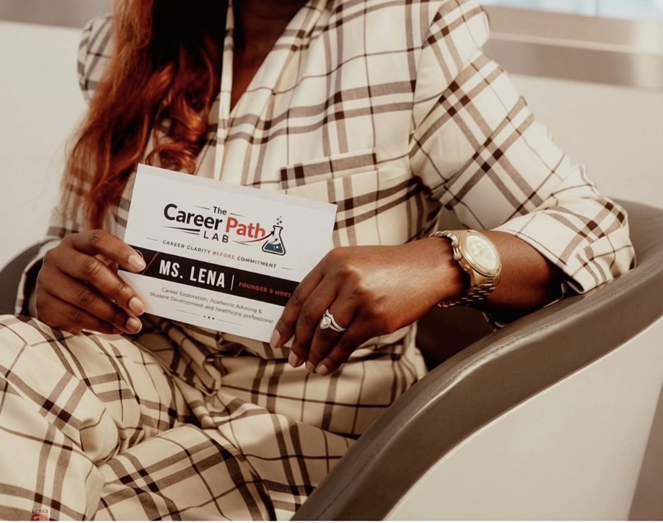 Ms. Lena holding The Career Path Lab business card